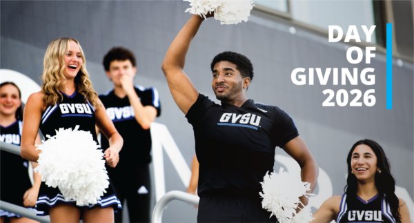 cheerleaders in black GVSU uniforms with white pompoms, Day of Giving 2026