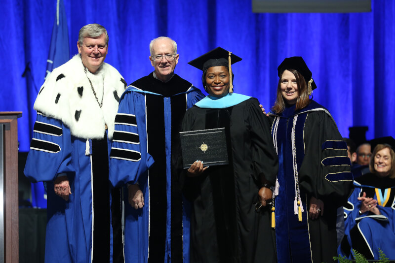 Teresa Weatherall Neal, second from right, gave the commencement address at the Saturday afternoon ceremony.