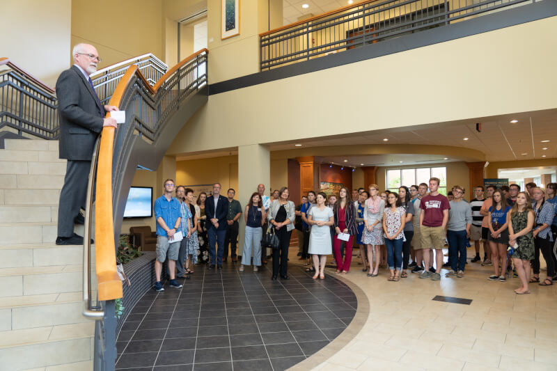 Frederik Meijer Honors College Director Roger Gilles speaks to a group of students and staff gathered to celebrate the 10-year anniversary of Niemeyer Learning and Living Center.