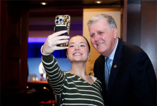 Dallas Mathews, left, takes a selfie with President Emeritus Thomas J. Haas. 