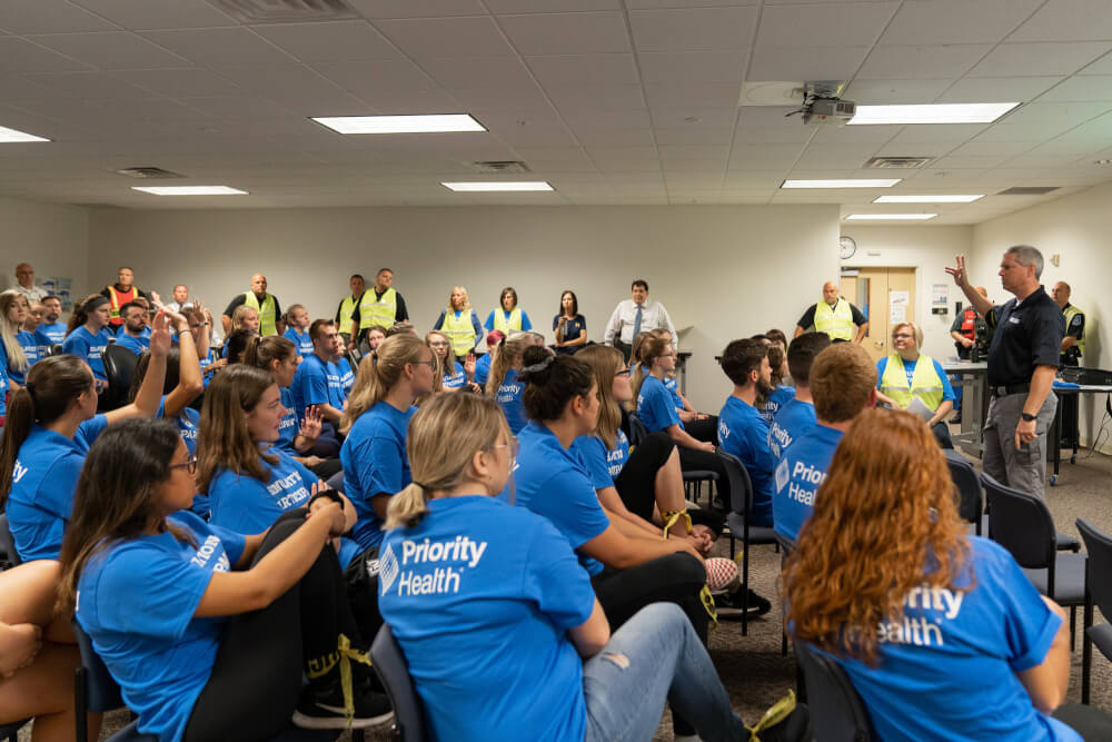 Students practice close-lock-barricade procedure.