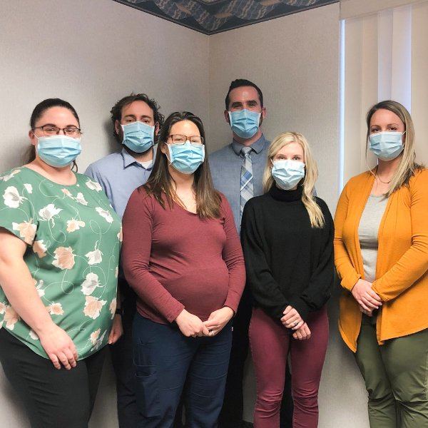From left to right are Brittany Oehlers, Christopher Laninga, Debra Swoverland, Jay Gillespie, Lara Gavaldon and Lindsey Banktson. All are wearing masks and pictured inside a conference room.