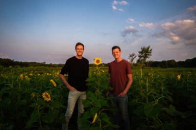 Ross and Jordan Bremer stand in their 'U-pick' sunflower field