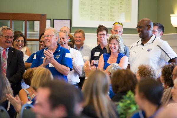 Keri Becker stands next to Walter Moore, associate athletic director for compliance.