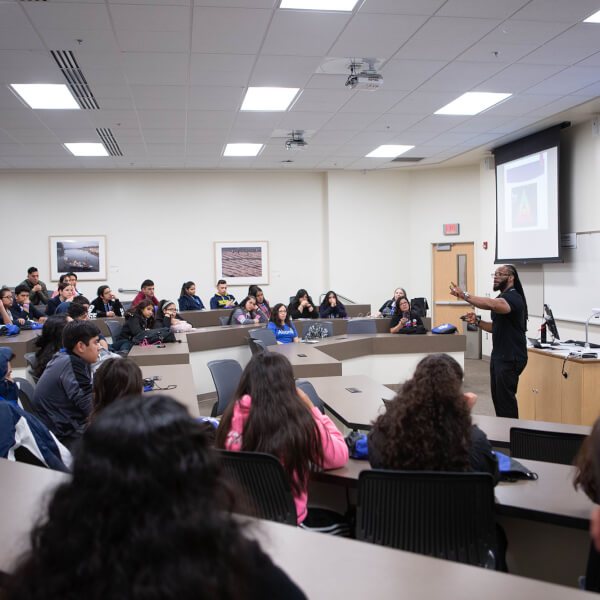 man standing in front of class 