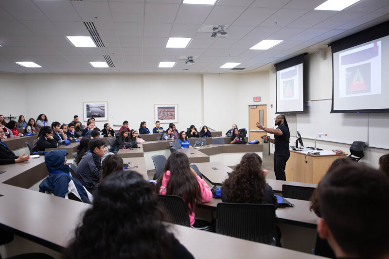 man standing in front of class 