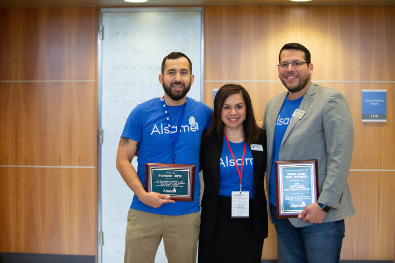 three people standing in row