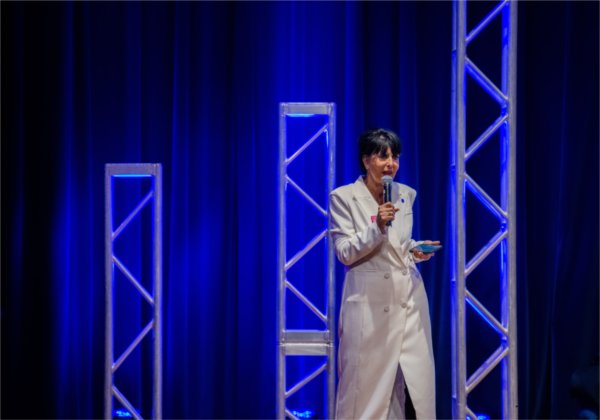 President Philomena V. Mantella welcomes guests and speakers to the "Tech Talks: AI & Human-Centered Design" at the DeVos Center's Loosemore Auditorium in Grand Rapids on September 18.