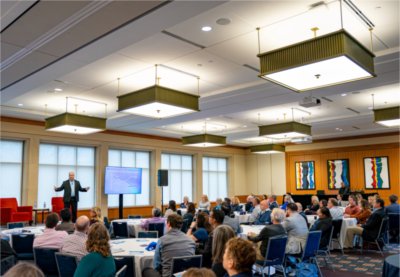 Associate Vice President for Academic Affairs Paul Isely speaks with audience members during a President's Forum discussion. 