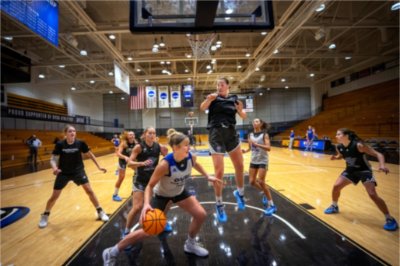 MacKenzie Bisballe drives under the basket during the GVSU Women's Basketball practice