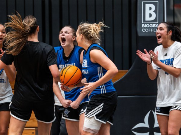 Players celebrate successful timed drill during practice.