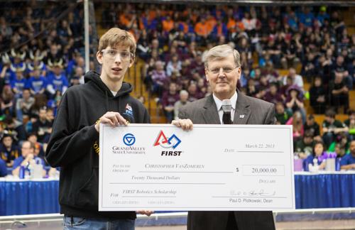 President Haas presented Chris Vanzomeren with the FIRST Robotics Engineering Scholarship during the competition's opening ceremony March 22.
