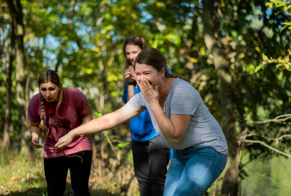 This was the reaction when a student picked up a snake and then realized that it was eating a frog.