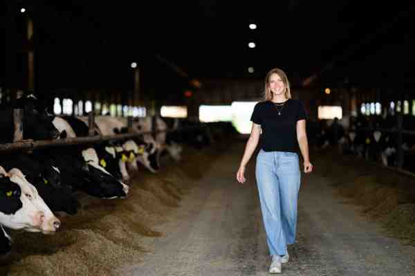 Senior Kendra Slater walks through a barn on her family's daily farm.