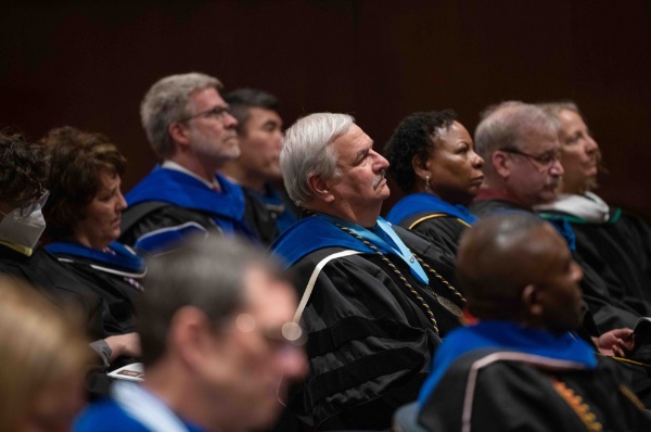 Deans of GVSU watch as faculty members receive their awards during the Faculty Awards Convocation.