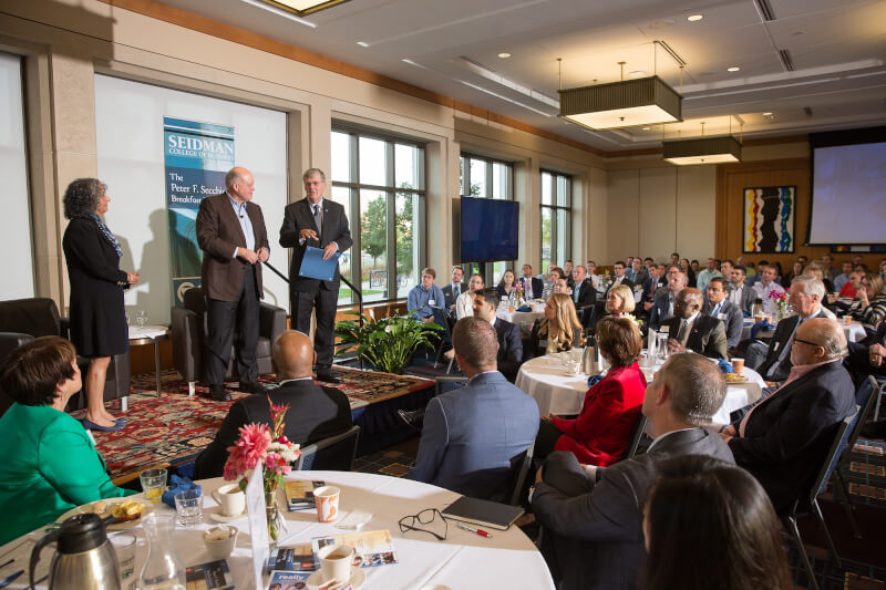 Diana Lawson, Jim Hackett and President Thomas J. Haas