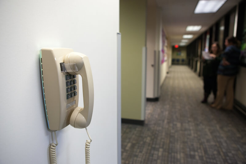 Landline phone attached to a wall