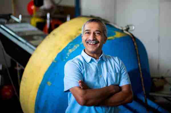 Professor of Water Resources Bopi Biddanda poses for a photo at the Annis Water Resources Institute