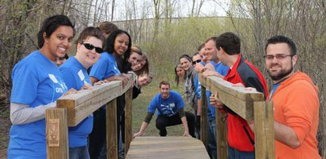 Volunteers help move a bridge while at the Humane Society of West Michigan
