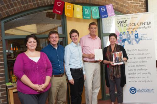 LGBT Resource Center staff members hold the letter from President Obama.