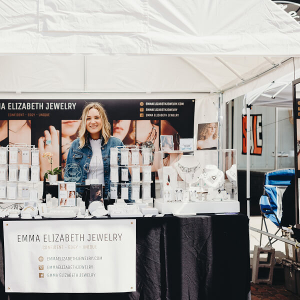 woman standing in booth at trade show