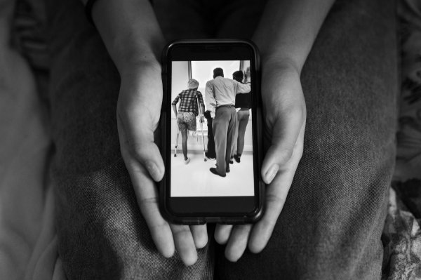 First-year student Sarah Conway shows a photo of herself learning to walk with crutches following an above-knee amputation.