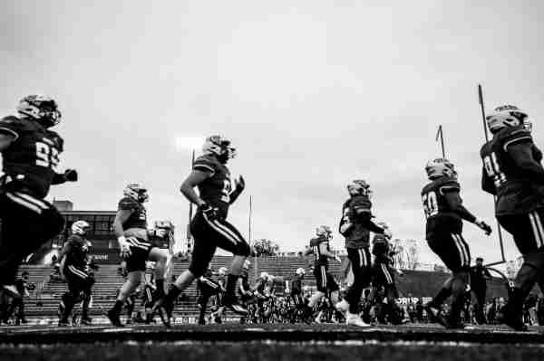 Football players warm up before game