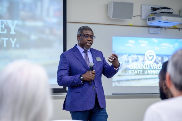 Dean Bayo Ogundipe gives remarks during the launch of Blue Spark during the Tech Week Grand Rapids event.