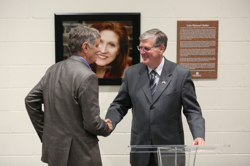 President Thomas J. Haas welcomes Fred Keller, Linn's husband, to the podium.