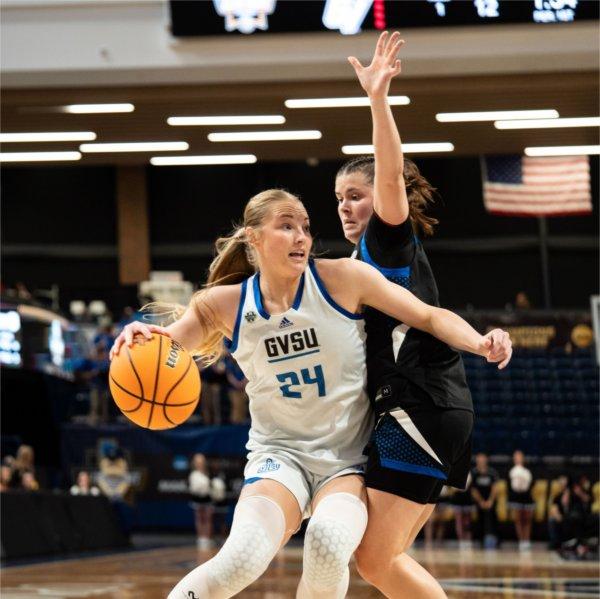 Paige VanStee drives past a UAH defender.