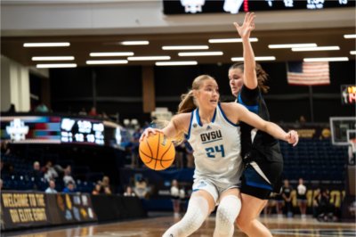 Paige VanStee drives past a UAH defender