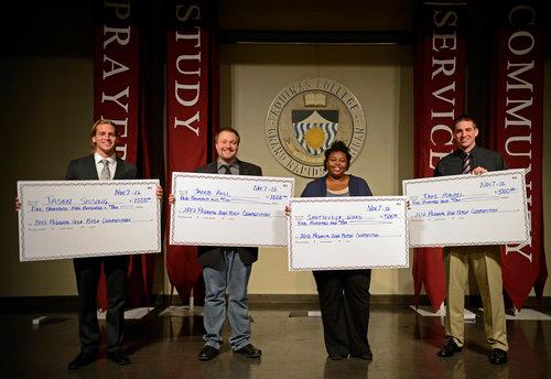 Jason Sissing, far left, won first prize and Jacob Hall, second from left, won second place.