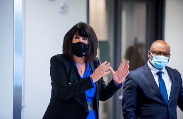 President Mantella gestures with her hands while Vice President Truss stands behind her