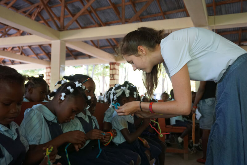 GVSU student Kayleigh Thomas teaching students during a fine motor skills workshop in Haiti.
