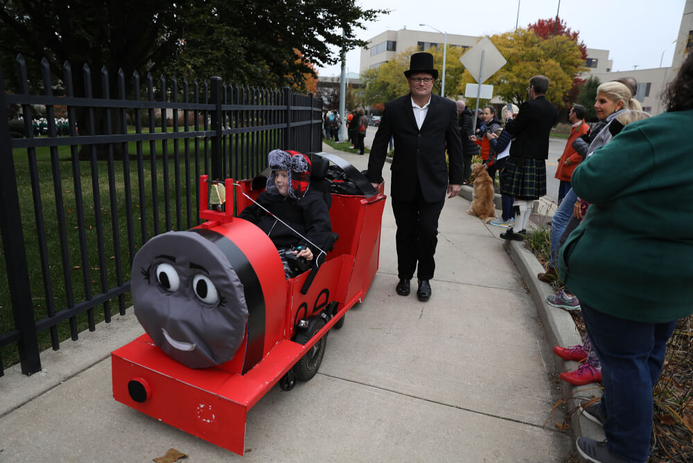 Nate Boersma dressed as a red train engine.