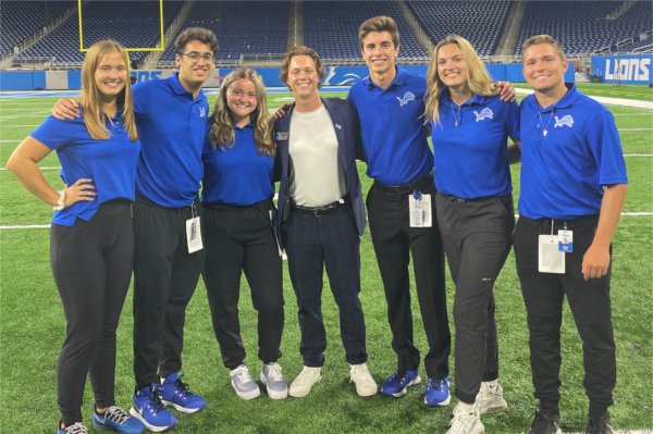 Annabel Gerrity with coworkers at Ford Field.