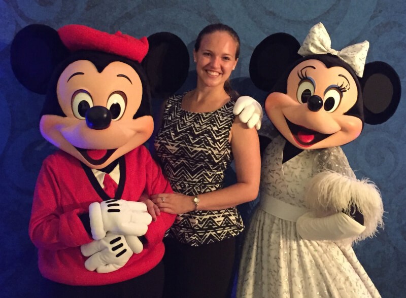 GVSU alumna Elizabeth Stolz pictured with Mickey and Minnie Mouse.