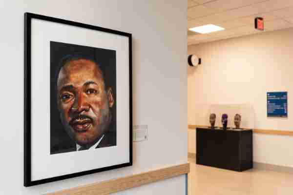 A portrait of the Rev. Dr. Martin Luther King Jr. hangs in one of the hallways of the Daniel and Pamela DeVos Center for Interprofessional Health.