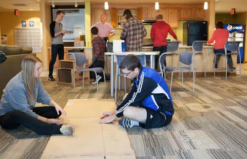 In this 2013 photo, students create games from cardboard. The Global Cardboard Challenge will be held February 27 in the Kirkhof Center.