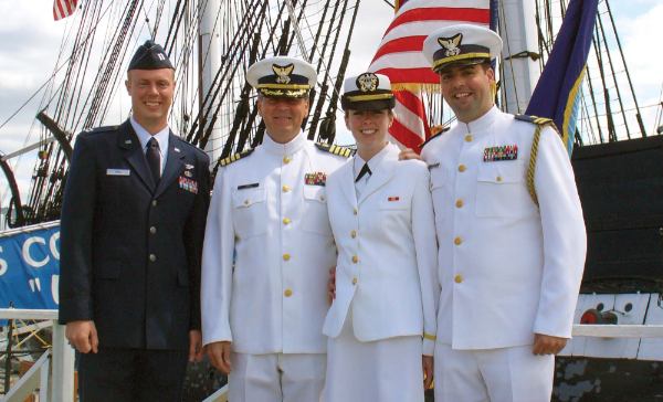 President Emeritus Thomas J. Haas pictured with his daughter and two sons, all in military uniform.