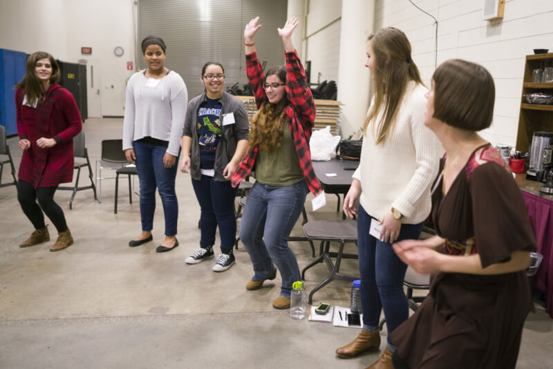 Kayla Torres, music performance major, participating in an ice breaker with local high school students.