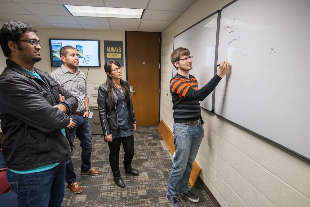 students looking at a whiteboard