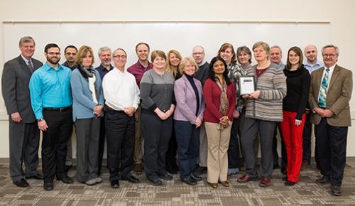 The Information Technology department is pictured with President Thomas J. Haas and leaders from Human Resources after receiving a 'Certified Healthy Department award.
