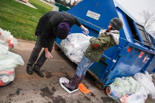 Students gather and weigh materials that will be composted or recycled.