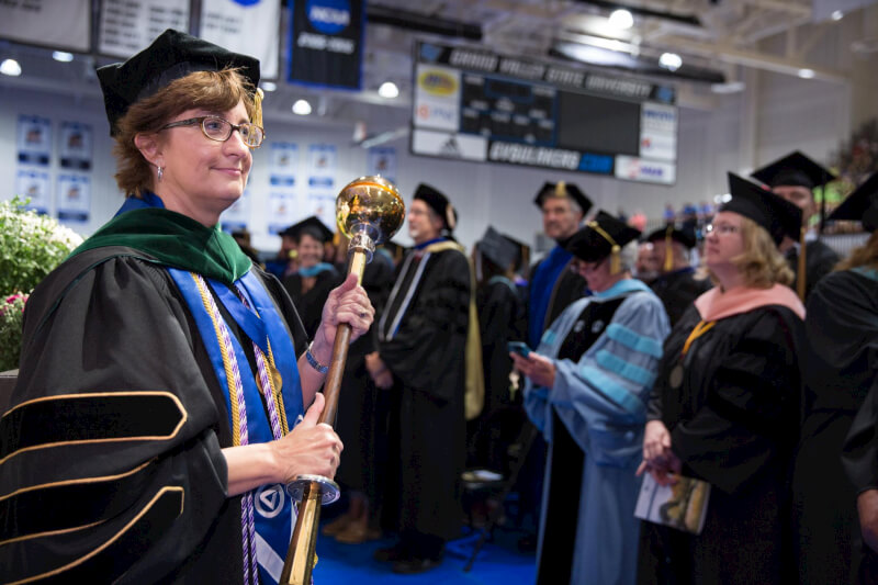 Nursing faculty member Joy Washburn is the mace bearer during convocation at the Fieldhouse August 26.