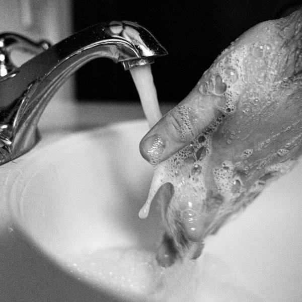 Hands with soap and water.