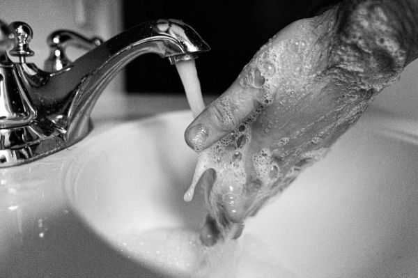 Hands with soap and water.