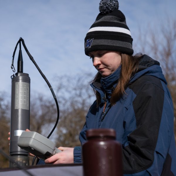 Graduate student Ellen Foley analyzes water collected from a lake.