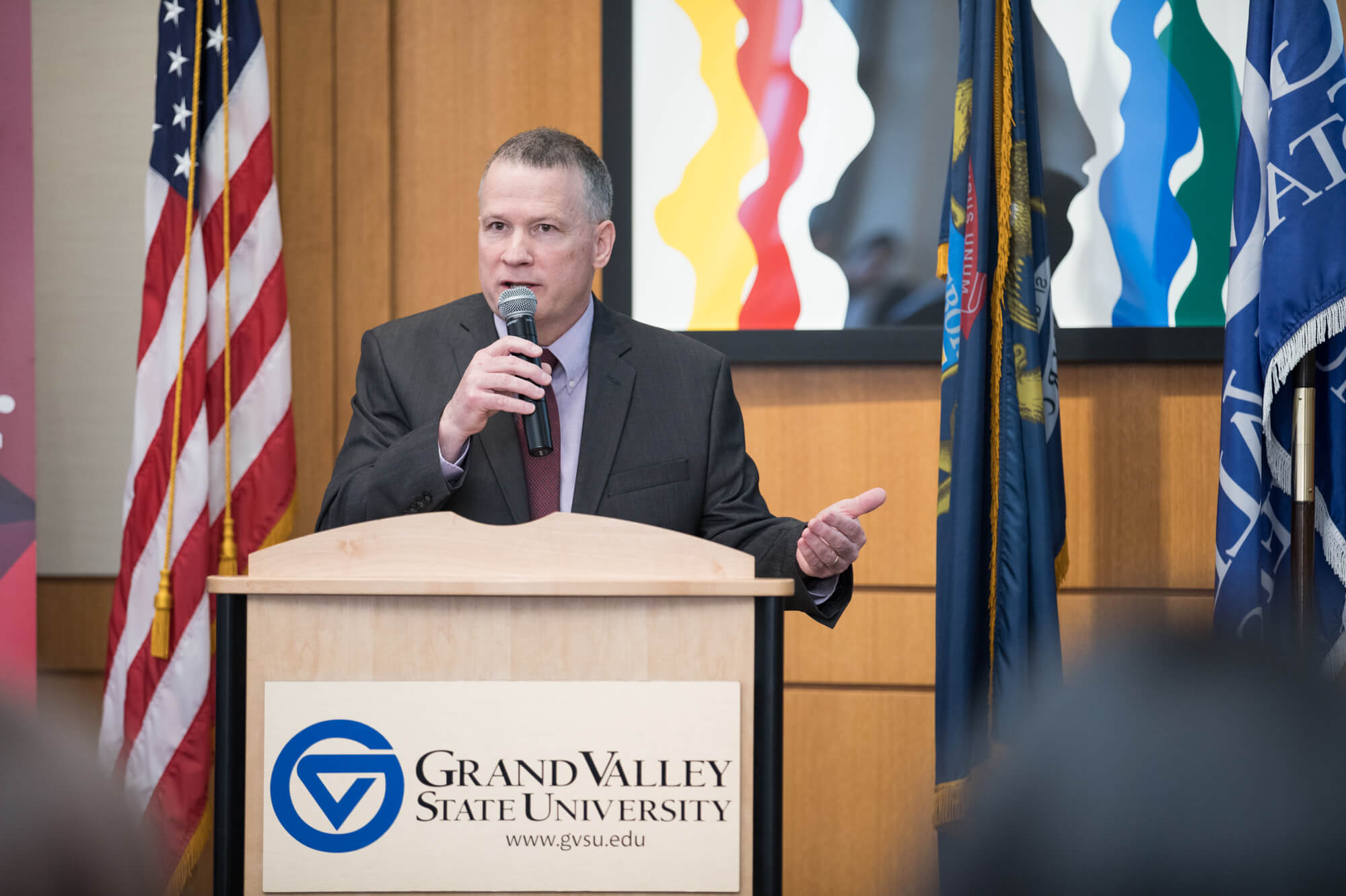 Man at podium with microphone