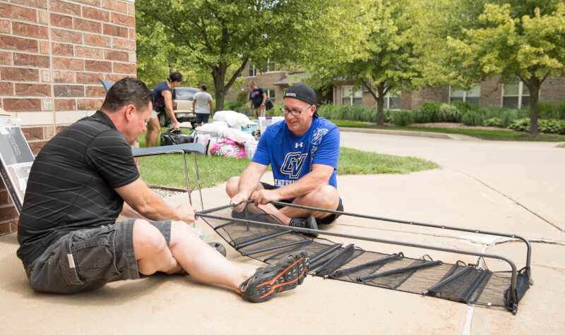  Two men setting up a shelf